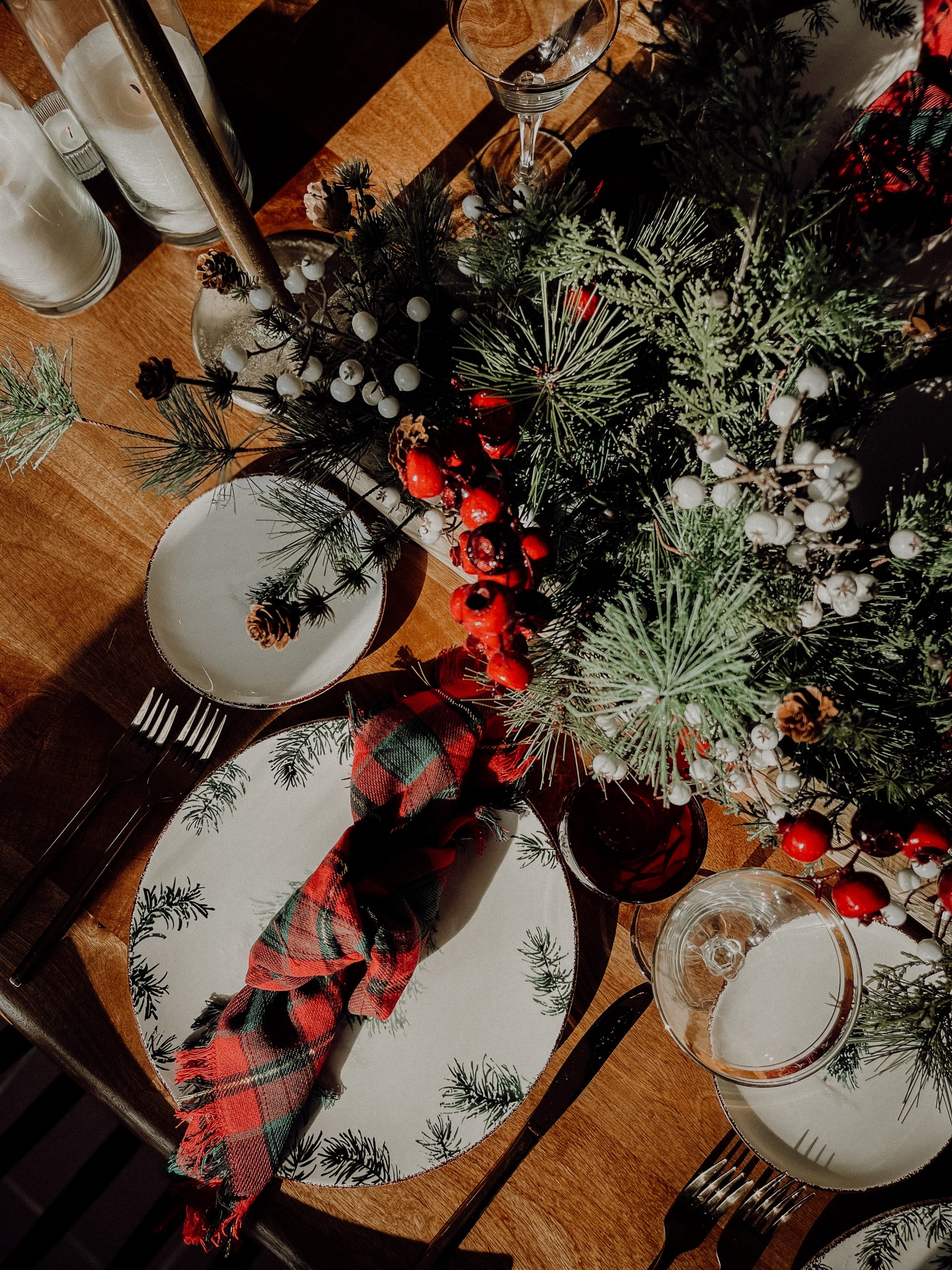 A traditional Christmas dining room table design with a modern twist featuring Tartan Plaid, pops of black and pine tree accents. 

See more on
www.mirandaschroeder.com