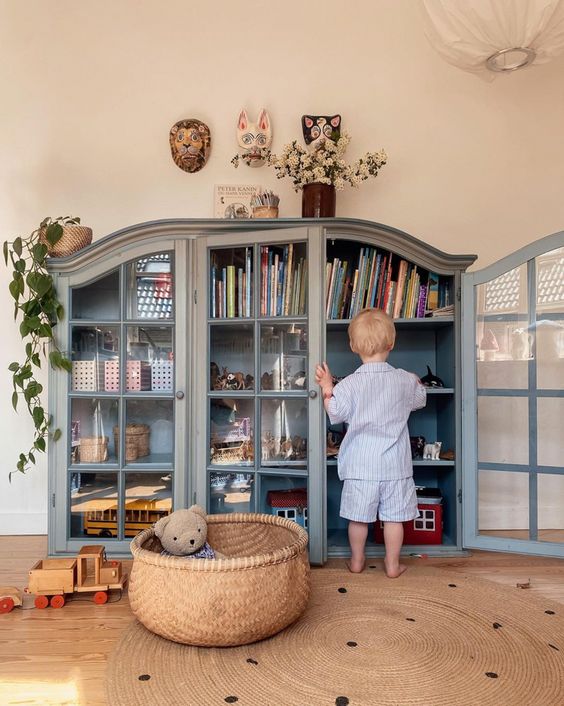 Kids playroom storage ideas with thrifted furniture.